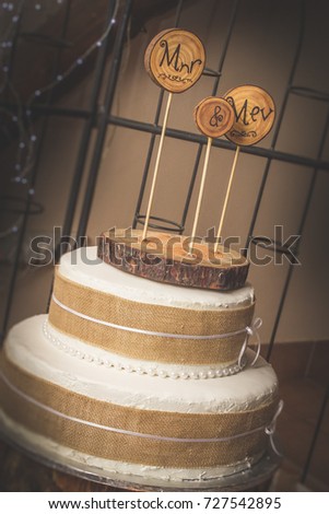 Rustic Wedding Cake With Wooden Mr And Mrs Toppers On Tree Stump Stand Rustic Wedding Cake With Wooden Mr And Mrs Toppers On Tree Stump Stand