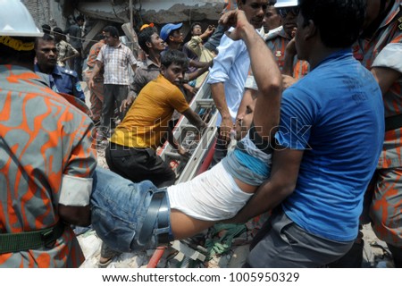 DHAKA, BANGLADESH - APRIL 24, 2013: Rescue workers try rescue trapped garment workers in the Rana plaza building which collapsed in Saver near Dhaka, Bangladesh on April 24, 2013.