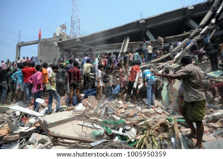 DHAKA, BANGLADESH - APRIL 24, 2013: Rescue workers try rescue trapped garment workers in the Rana plaza building which collapsed in Saver near Dhaka, Bangladesh on April 24, 2013.