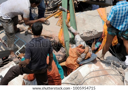 DHAKA, BANGLADESH - APRIL 24, 2013: Rescue workers try rescue trapped garment workers in the Rana plaza building which collapsed in Saver near Dhaka, Bangladesh on April 24, 2013.