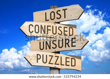wooden signpost four arrows lost confused stock photo edit now