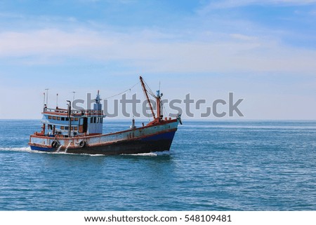 Fishing boat is out fishing. Fishermen is a career that has been popular in the seaside city of Thailand.