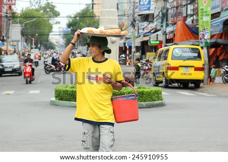Can Tho, Vietnam. June 14, 2014 : Unidentified street hawker selling bread at Can Tho, Vietnam on June 14, 2014.Mobile street hawker selling food is common across city in Vietnam.