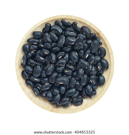 Black beans in wooden bowl isolated on white background