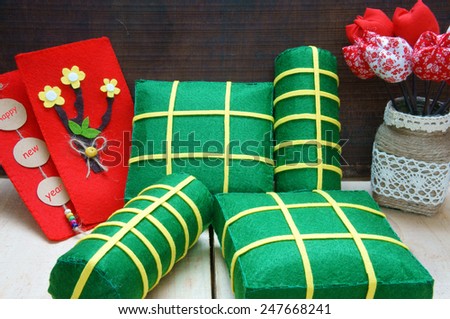 Vietnamese food, banh chung, banh tet are traditional eating on Tet holiday, wrap in green leaf. When spring come, on Vietnam Lunar New Year , people worship the ancestor with glutinous rice cake