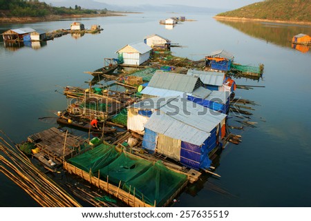 DAKLAK, VIET NAM- FEB 26: Asian residence on water, group of floating house of fishing village, beautiful Vietnamese countryside, impression panoramic, Dak Lak, Vietnam, Feb 26, 2015