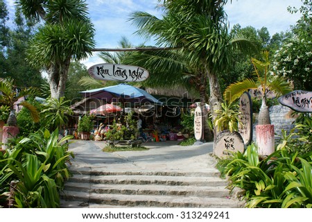 QUY NHON, VIET NAM- AUG 23: Han Mac Tu, a fomous Vietnamese poet, short life artist, his grave at Genh Rang tourist area, poem in calligraphy on wooden background, Quynhon, Vietnam, Aug 23, 2015