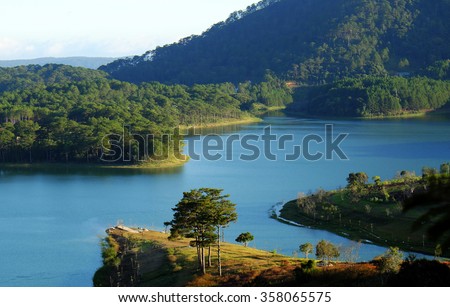 Tuyen Lam lake at Dalat, Vietnam, beautiful landscape for eco travel at Viet Nam, amazing lake among pine forest make wonderful scene, boat on water, Da Lat countryside is famous place for holiday