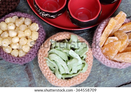 Vietnamese food for Tet holiday in spring, jam is traditional food on lunar new year, can make from sweet potato, lotus seed, ginger with sugar, colorful background for Vietnam custom