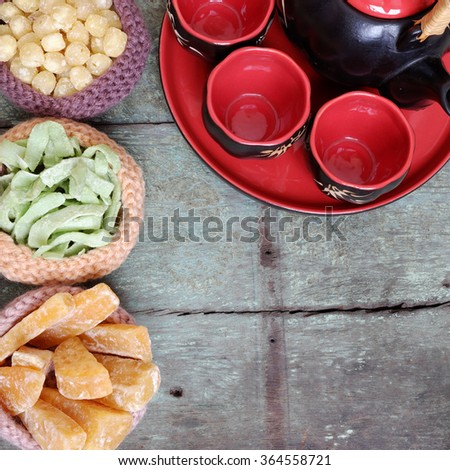 Vietnamese food for Tet holiday in spring, jam is traditional food on lunar new year, can make from sweet potato, lotus seed, ginger with sugar, colorful background for Vietnam custom