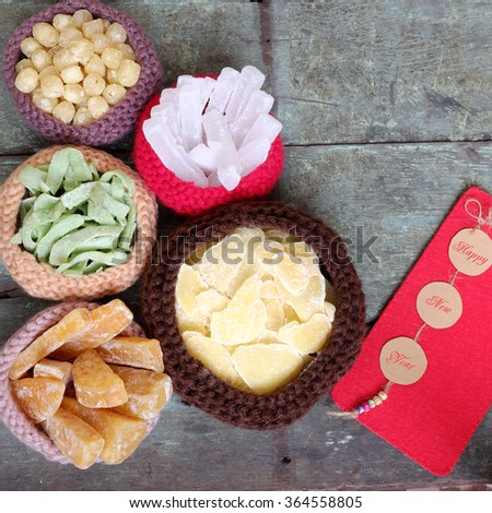 Vietnamese food for Tet holiday in spring, jam is traditional food on lunar new year, can make from sweet potato, lotus seed, ginger with sugar, colorful background for Vietnam custom