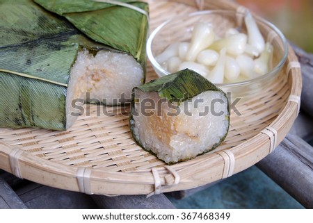 Vietnamese food for Tet holiday in spring, banh chung is traditional food on lunar new year, a rice cake stuffed with pork, green bean, is tradition culture in spring