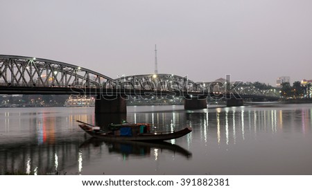 HUE, VIET NAM- FEB 19, 2016: Truong Tien Bridge, cross Huong river, an old bridge link with history, Trang Tien brigde reflect on water, old architect, make from steel, landscape at evening, Vietnam