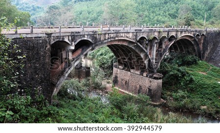 QUANG TRI, VIET NAM- FEB 23, 2016: Dau Mau bridge on Ho Chi Minh trail, an old bridge link with Vietnam war history make by French locate at Cam Lo, with amazing architect, pass green jungle