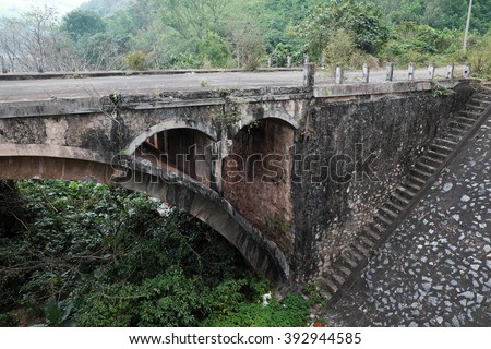 QUANG TRI, VIET NAM- FEB 23, 2016: Dau Mau bridge on Ho Chi Minh trail, an old bridge link with Vietnam war history make by French locate at Cam Lo, with amazing architect, pass green jungle