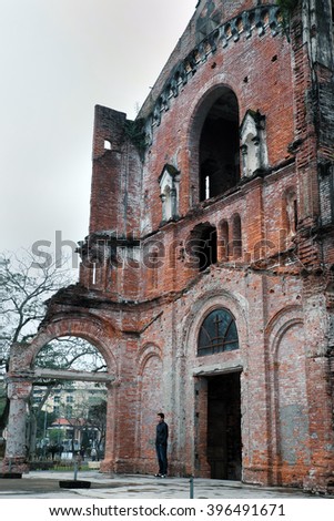 QUANG TRI, VIET NAM- FEB 20, 2016: Old church at La Vang holy land with ancient red brick wall, a place for Christian faithful to go pilgrimage, amazing old architect at Quangtri, Vietnam