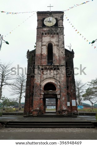 QUANG TRI, VIET NAM- FEB 20, 2016: Old church at La Vang holy land with ancient red brick wall, a place for Christian faithful to go pilgrimage, amazing old architect at Quangtri, Vietnam