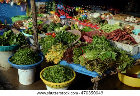CA MAU, VIET NAM- JULY 15, 2016: Roadside food stalls at Mekong Delta countryside, farmer market sell green vegetable from agriculture product, Camau, Vietnam