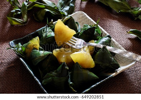 Vietnamese traditional food for may 5th, is double five festival or tet doan ngo, sticky rice cake in green leaf, also call banh u tro with pyramidal shape