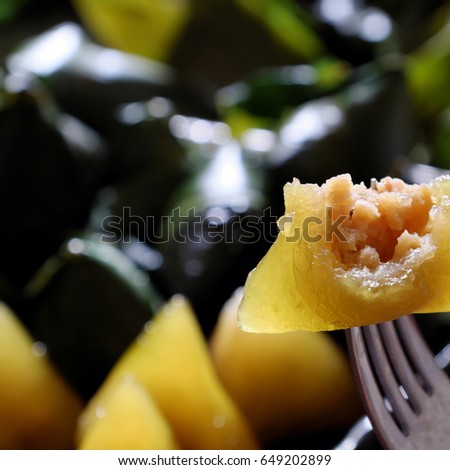 Vietnamese traditional food for may 5th, is double five festival or tet doan ngo, sticky rice cake in green leaf, also call banh u tro with pyramidal shape