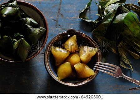 Vietnamese traditional food for may 5th, is double five festival or tet doan ngo, sticky rice cake in green leaf, also call banh u tro with pyramidal shape