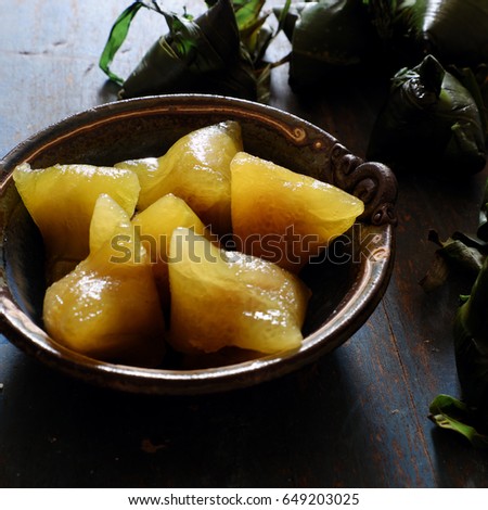 Vietnamese traditional food for may 5th, is double five festival or tet doan ngo, sticky rice cake in green leaf, also call banh u tro with pyramidal shape