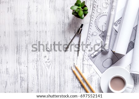 Architect at work. Drawing and tools on light wooden desk top view copyspace