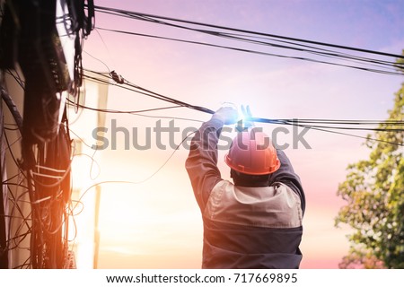 Electricians are dismantling the wiring from the building.The electrician made a bad mistake and was electrocuted.Electrical system development.Technician cutting cable.