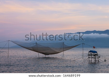 CIRCA APRIL 2010 - QUY NHON, VIETNAM - Fishing nets standing at rest off the shore, on 25 April 2010, at Quy Nhon, Vietnam.