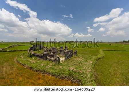 CIRCA APRIL 2010 - QUY NHON, VIETNAM - An ancient family tomb amongst rice fields, on 25 April 2010, in Quy Nhon, Vietnam.