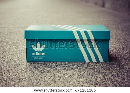 BANGKOK, THAIAND - JULY 2, 2017: Adidas Sign On Adidas Shoe Box. Founded in 1924 is a German multinational corporation that designs and manufactures sports shoes, clothing and accessories.