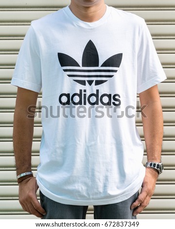 BANGKOK, THAILAND - JULY 2, 2017: Adidas logo on man T-shirt. Adidas is German designer and manufacturer of sports clothing and accessories; largest in Europe and 2nd biggest in the world.