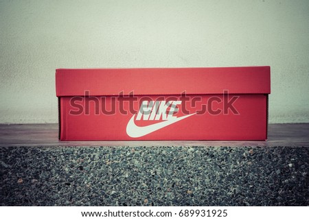 BANGKOK, THAILAND - JULY 2, 2017: Nike box shoes on stone floor, Nike, Inc. is an American multinational corporation that designs, develops, manufactures and sells footwear and other items