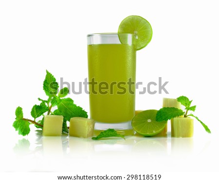 natural juice making from the sugarcane decoration with lime,mint on white background