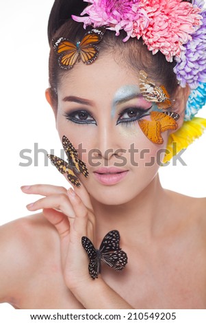 https://thumb7.shutterstock.com/display_pic_with_logo/1843625/210549205/stock-photo-asian-beautiful-girl-with-colorful-make-up-with-fresh-flowers-and-butterfly-beauty-face-head-and-210549205.jpg