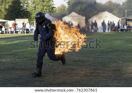 Astle Park, Cheshire, UK - August 12 2017: A stuntman on fire at Astle Park Traction Engine Rally