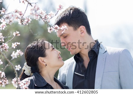 http://thumb7.shutterstock.com/display_pic_with_logo/187549/412602805/stock-photo-attractive-couple-in-blossoming-park-asian-girl-and-european-guy-among-of-blossoming-almond-412602805.jpg