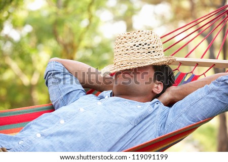 Image result for person relaxing under a hammock