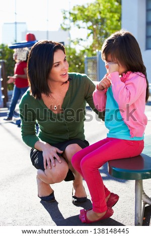 Teacher Comforting Upset Elementary School Pupil