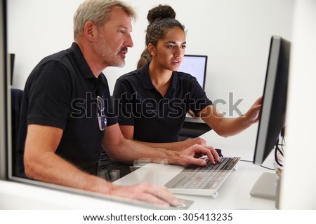Engineers Using CAD System In Design Studio