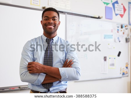 Portrait of confident African American male teacher in class