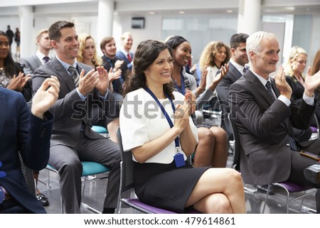 Audience Applauding Speaker After Conference Presentation