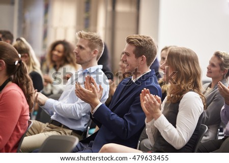 Audience Applauding Speaker After Conference Presentation