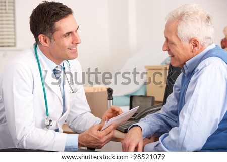 American doctor talking to senior man in surgery