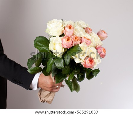 stock photo man with big beautiful bouquet of nice flowers roses 565291039