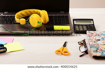 Workspace with teenage accessories and computer. Selective focus