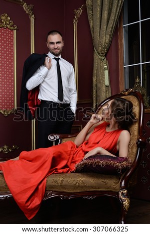 https://thumb7.shutterstock.com/display_pic_with_logo/1913192/307066325/stock-photo-man-and-woman-girl-lady-man-dressed-in-black-suit-woman-in-dress-they-love-each-other-love-307066325.jpg