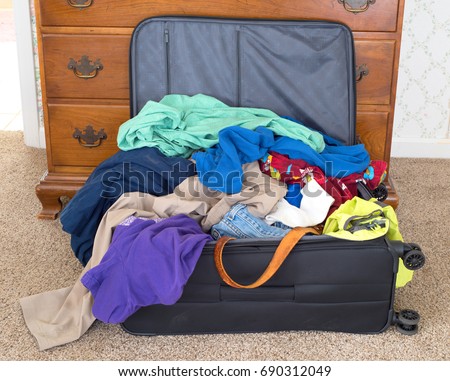 https://thumb7.shutterstock.com/display_pic_with_logo/192178/690312049/stock-photo-messy-packed-suitcase-of-a-man-s-on-vacation-in-a-rental-house-or-hotel-it-s-a-horizontal-closeup-690312049.jpg