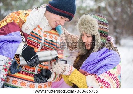https://thumb7.shutterstock.com/display_pic_with_logo/1928840/360686735/stock-photo-a-couple-in-love-in-a-snowy-park-valentine-s-day-asian-girl-a-european-man-360686735.jpg