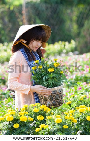 Sa Dec, Vietnam 17 Feb 2013: Gardeners care for the flowers in their garden in Sa Dec, Dong Thap, Vietnam. Sa Dec is flower producing center
